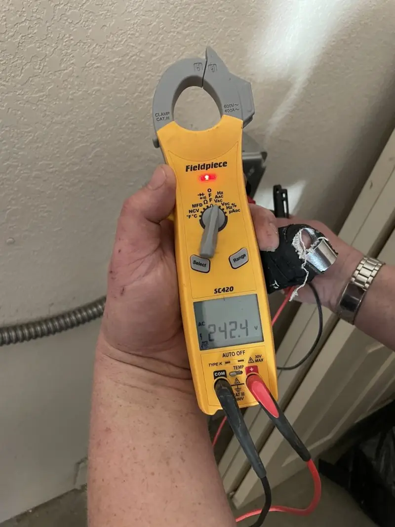 Voltage testing with clamp meter during Generator Installation in North Fort Myers